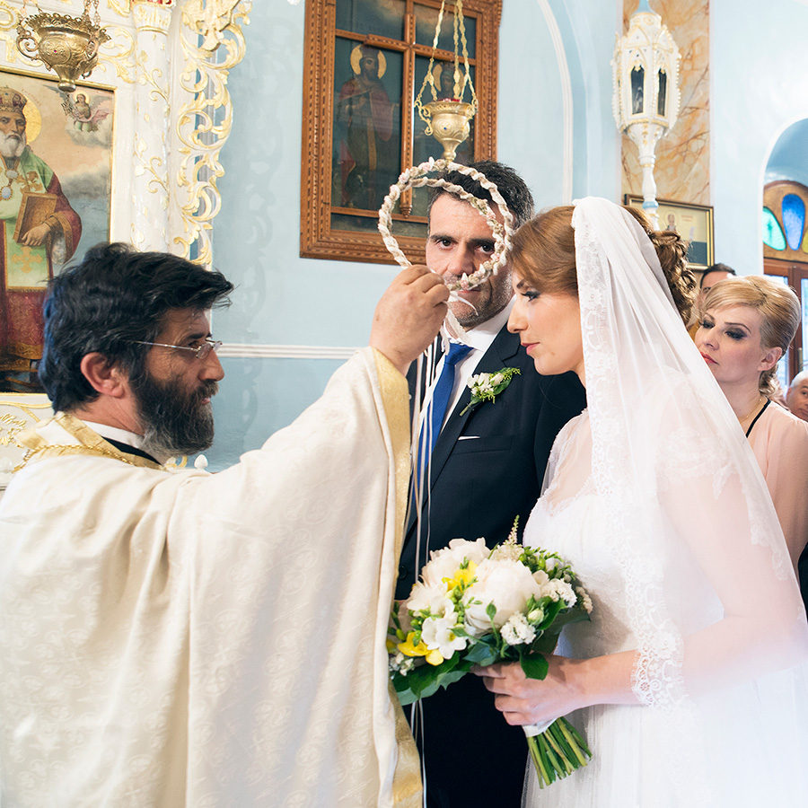 Greek wedding. stefana. Orthodox church. Bride and groom. Chios, Greece. Alepa Katerina . Layer Photography