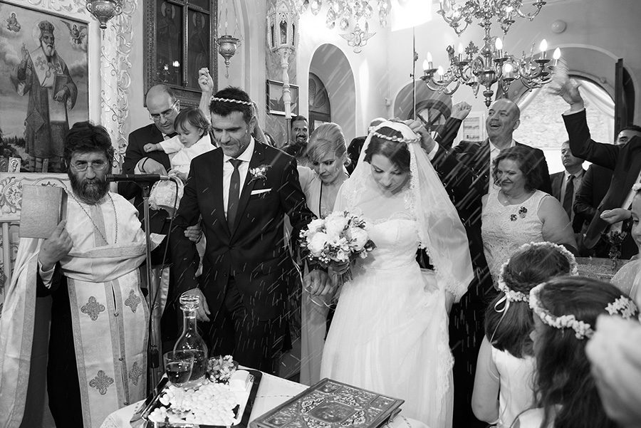 Greek wedding. Rice. Orthodox church. Isaias dance. Bride's and Groom's portrait. Chios, Greece. Alepa Katerina . Layer Photography