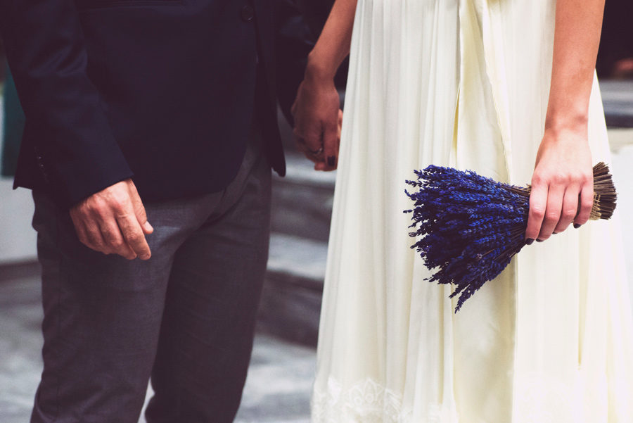 Town hall. Couple in love. Happy life, bride and groom holding hands, close up portrait. Flowers. Wedding bouquet. Civil wedding in Thessaloniki, Greece