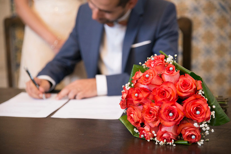 Signing the wedding papers. wedding flowers. Santuário de Nossa Senhora dos Remédios, Shrine of Our Lady of Remedies the cathedral in Lamego.Portugal. Layer Photography. Alepa Katerina