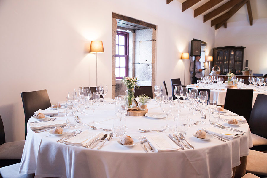 The table is ready. flowers. wine glasses. lights. glamour and chic. arte della table. Wood, glass. Bride and Groom. Wedding dinner.Quinta Vale De Locaia Lamego . Portugal . Layer Photography. Alepa Katerina